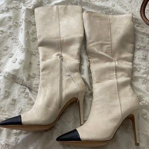 Cream boots with black leather toe detail